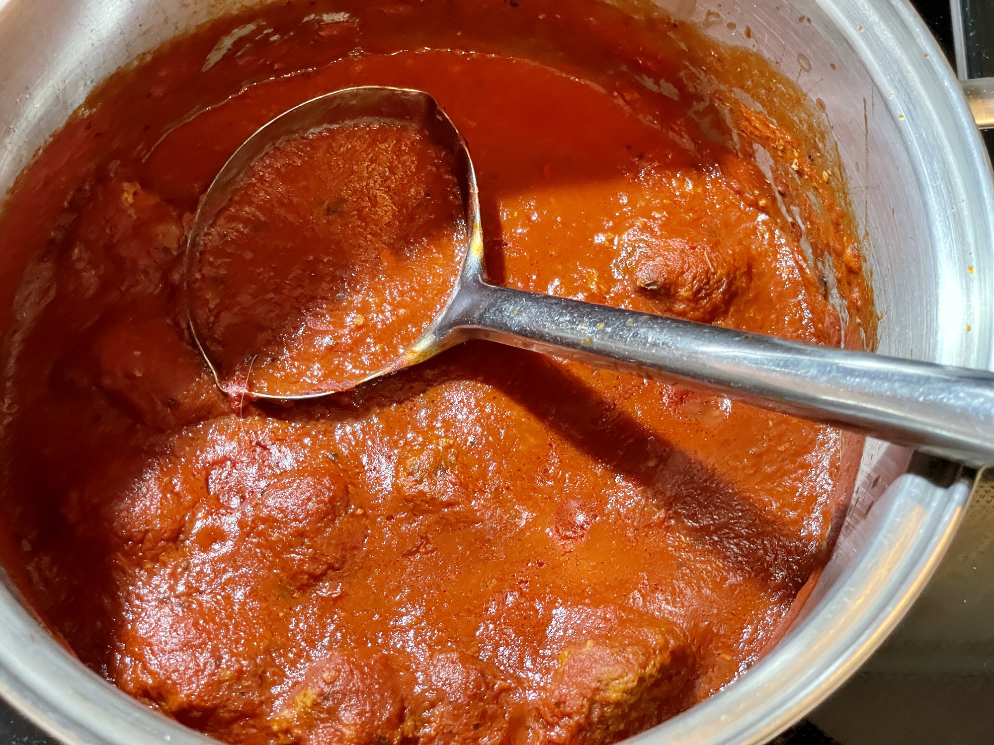 Spaghetti sauce in a pot.