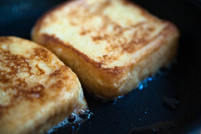 Cooking French toast in a frying pan.