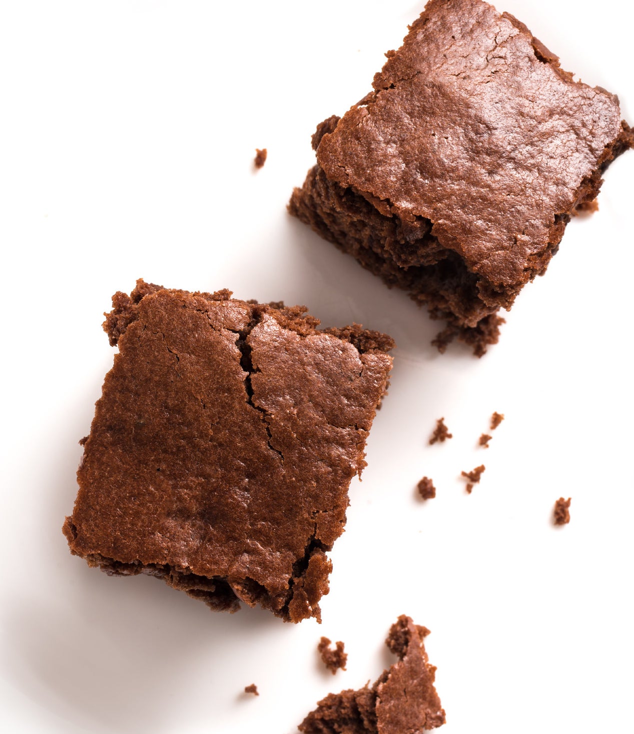 Two brownies on a white background.