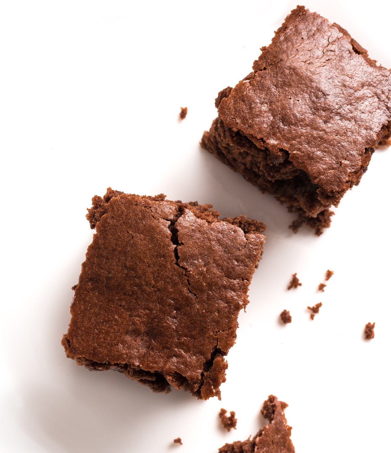 Two brownies on a white background.