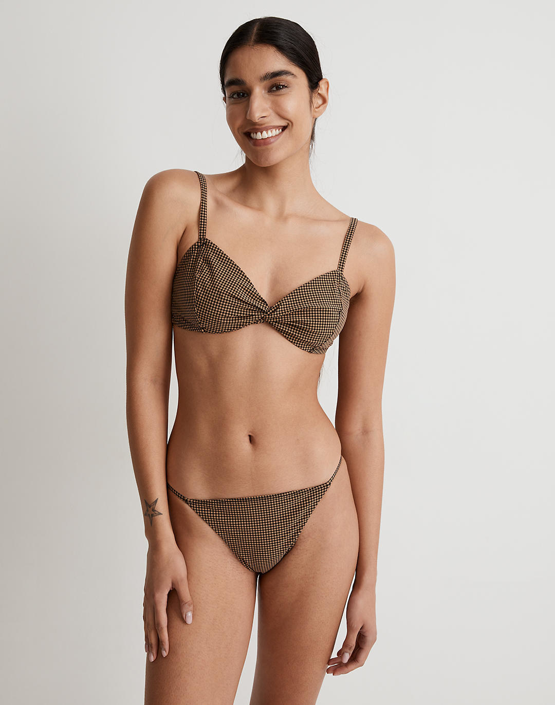 model in the brown and tan small checked twist front bikini top and adjustable string bottoms