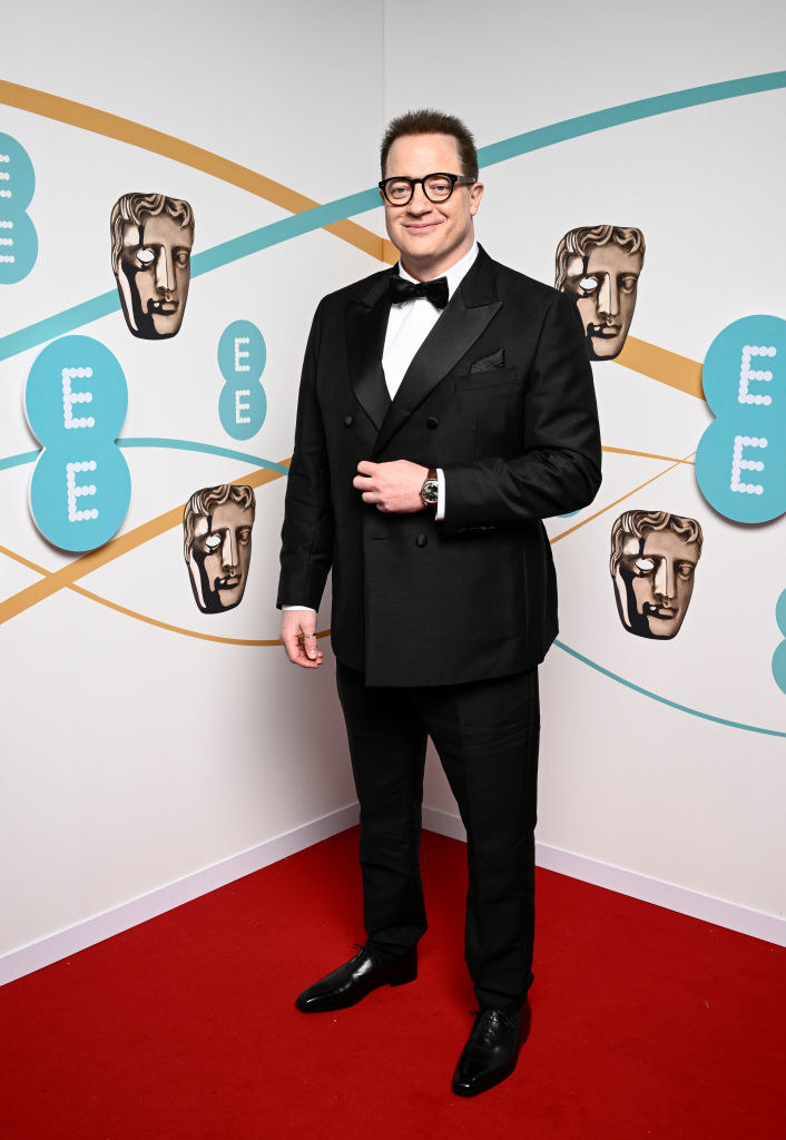Brendan Fraser attends the EE BAFTA Film Awards 2023 at The Royal Festival Hall in a suit