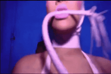 Rihanna in pink latex with whip