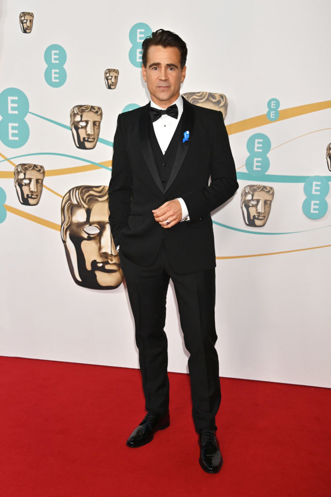 Colin Farrell arrives at the EE BAFTA Film Awards 2023 at The Royal Festival Hall in a traditional suit