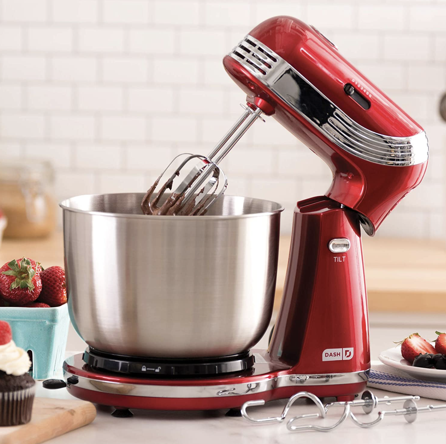the stand mixer with cake batter in it on a counter