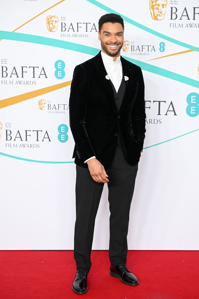 Regé-Jean Page attends the EE BAFTA Film Awards 2023 at The Royal Festival Hall in a traditional suit