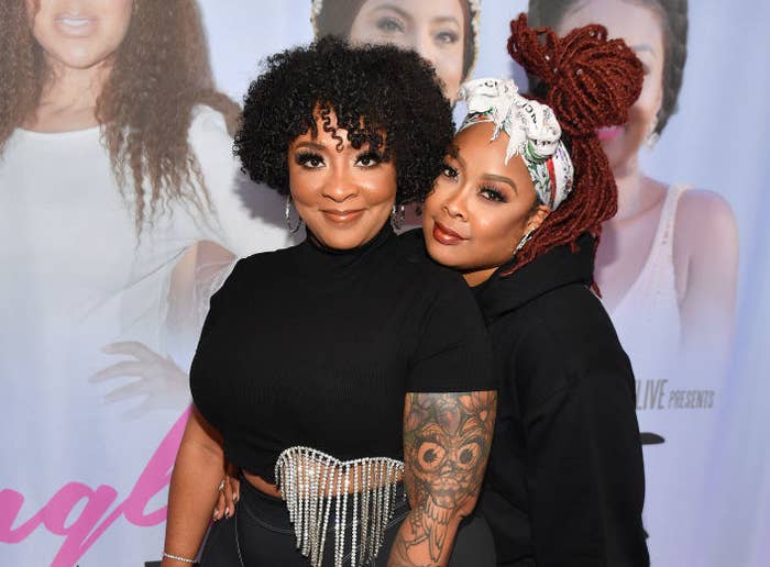 DaBrat holds her arms around Jesseca "Judy" Dupart as they attend a movie premiere