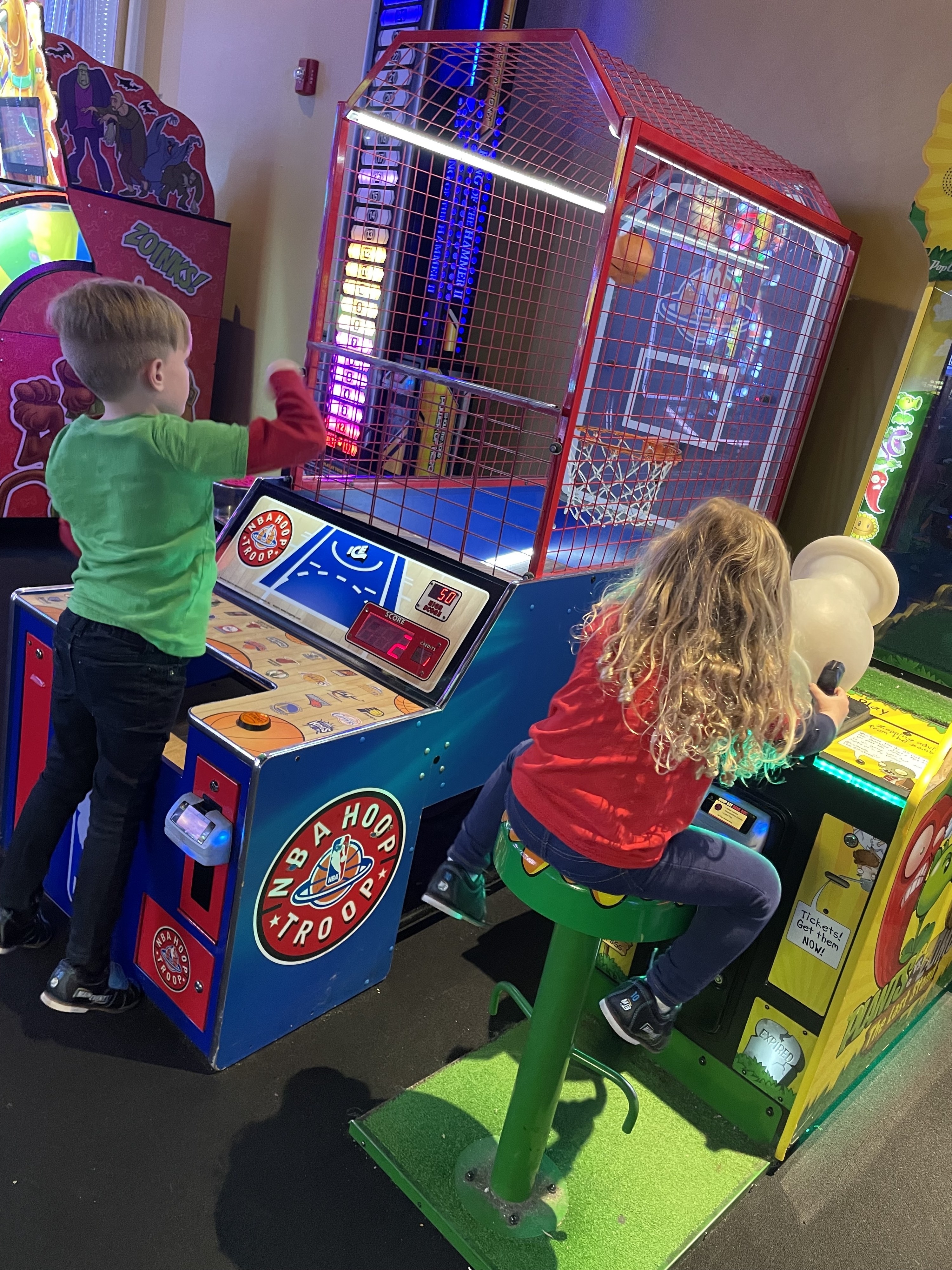 the author&#x27;s kids playing at an arcade