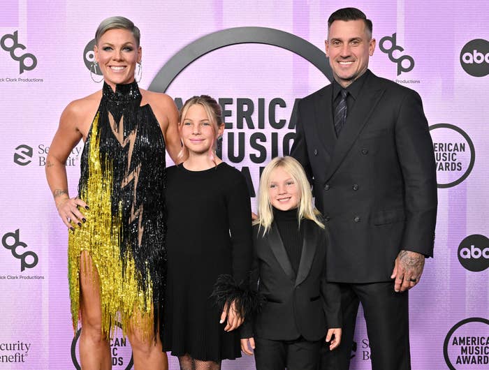 Pink poses with her husband and their two children