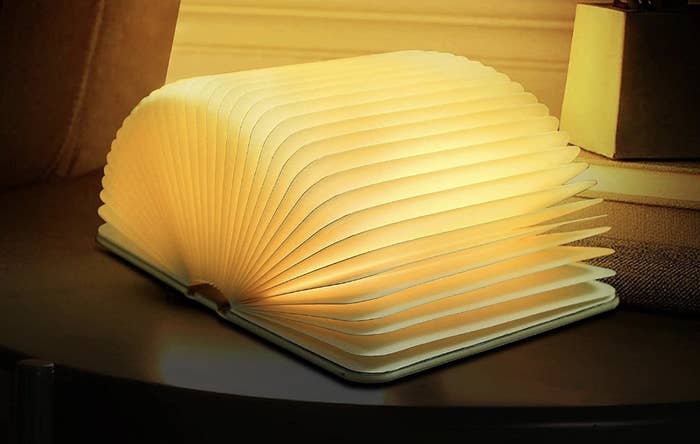 the book lamp open and lit up