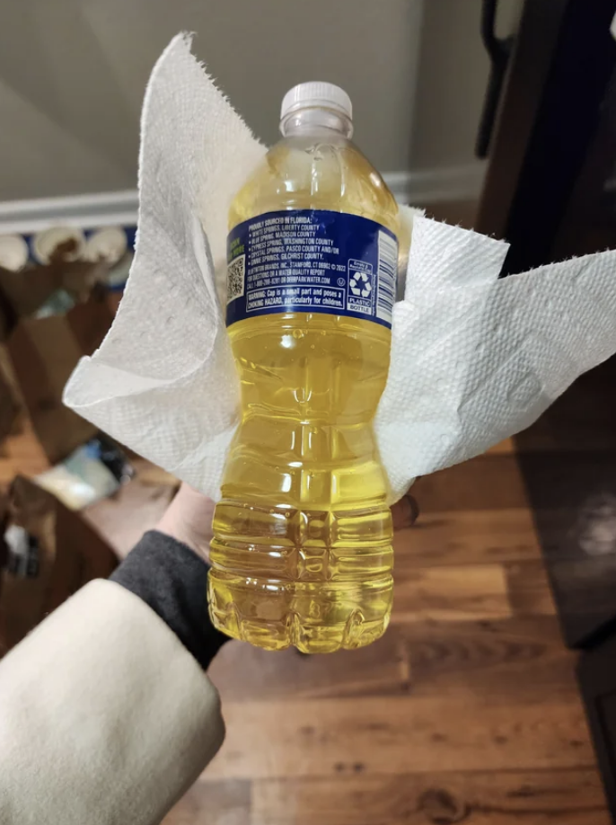 A bottle with yellow liquid