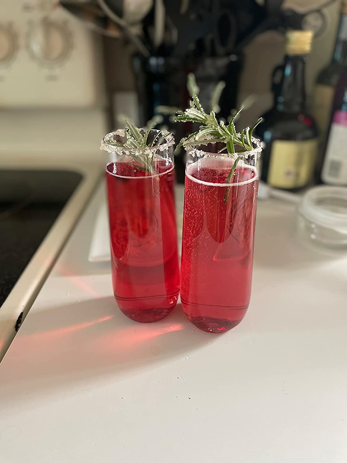 Reviewer image of flutes filled with red cocktail