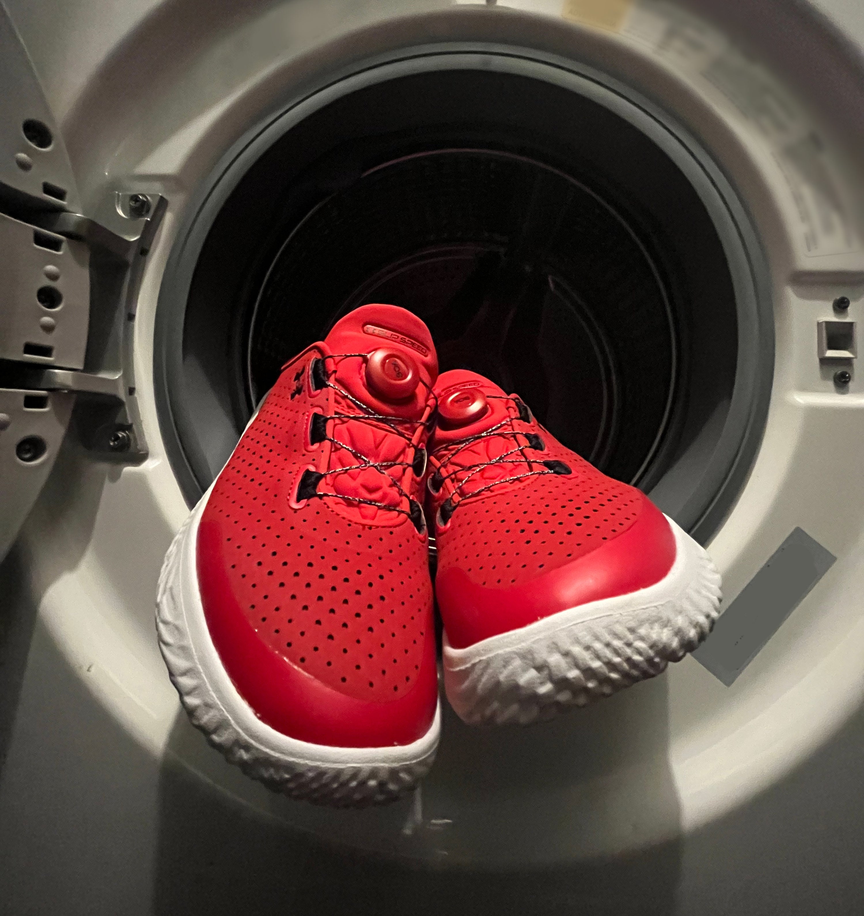 the shoes on the opening of the washing machine