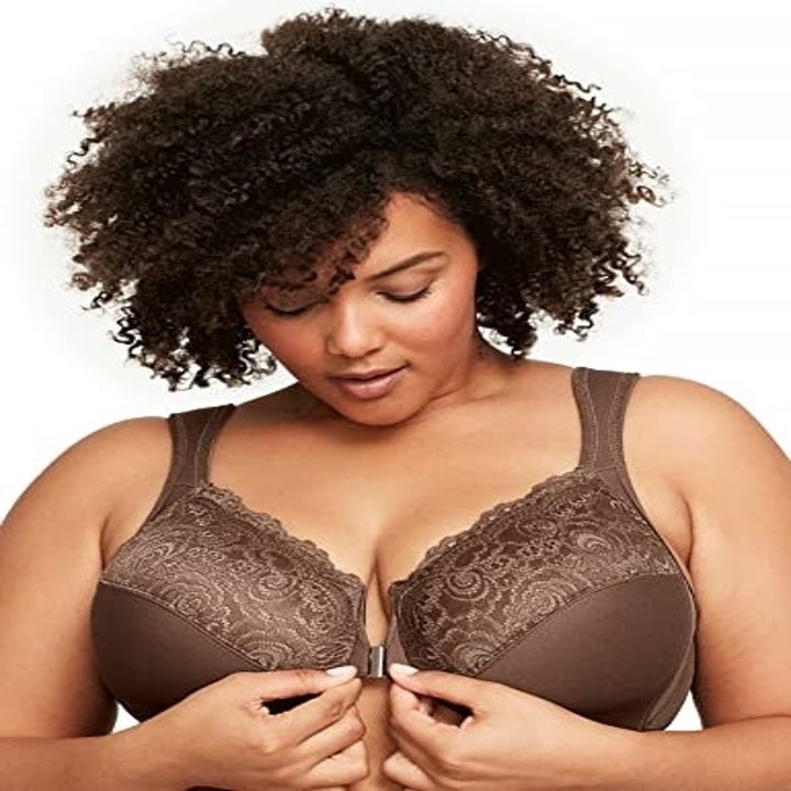 Model clasping the mocha bra