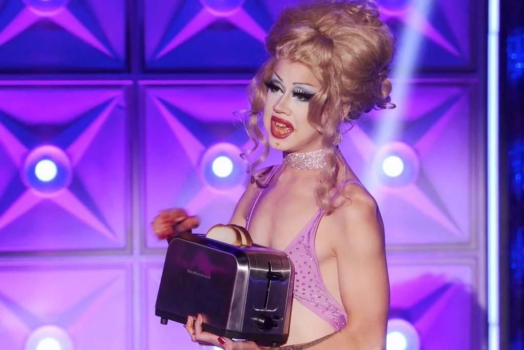 Willow holding a toaster with two slices in it