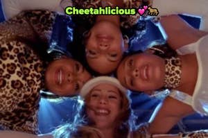 The Cheetah Girls wearing cheetah print and white huddled up