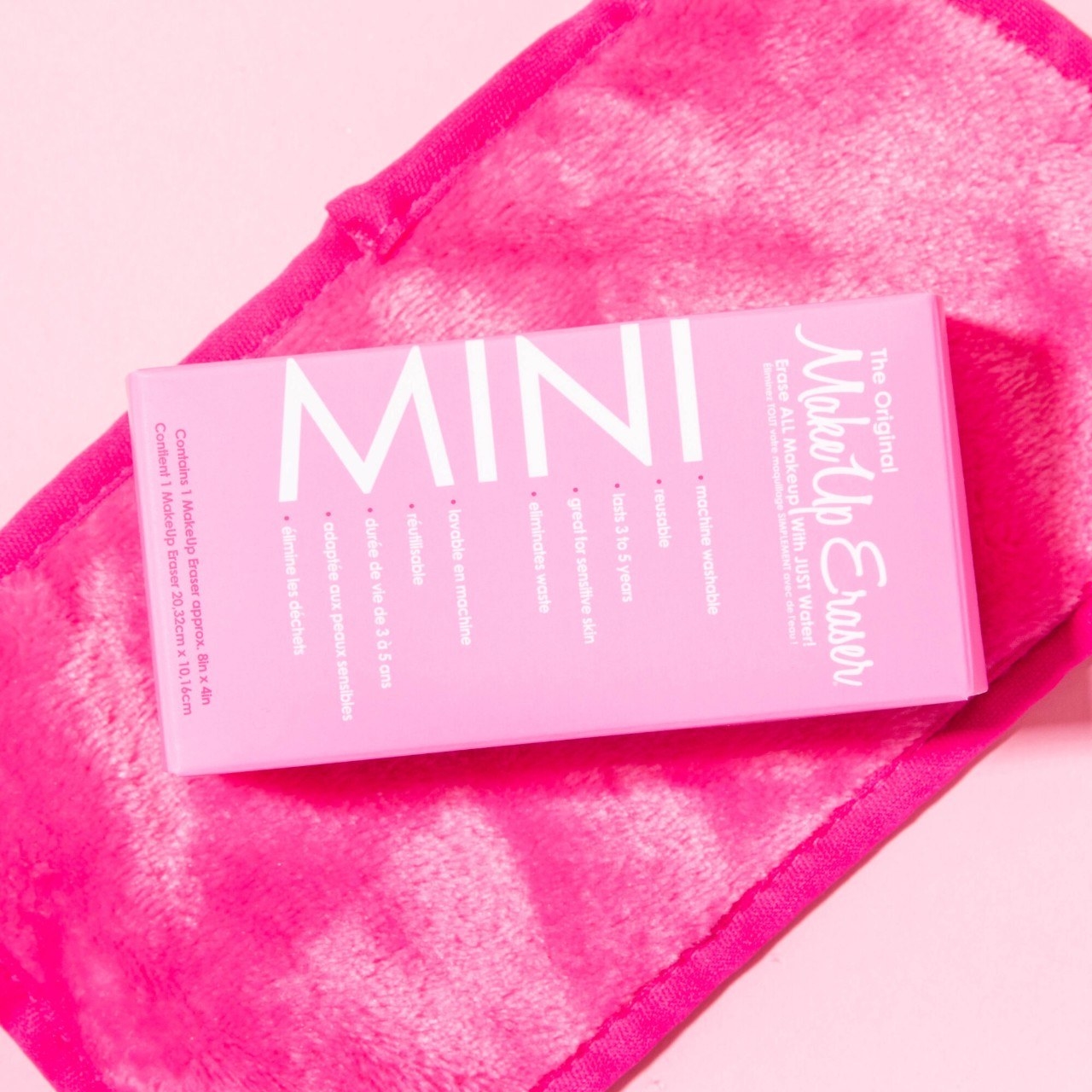 a mini makeup eraser cloth next to its packaging