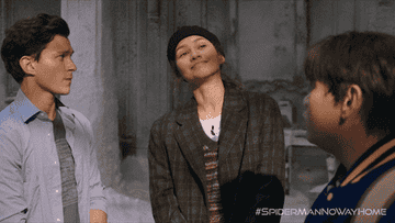 Ned, Peter, and MJ looking up at someone out of frame in &quot;Spider Man: No Way Home&quot;