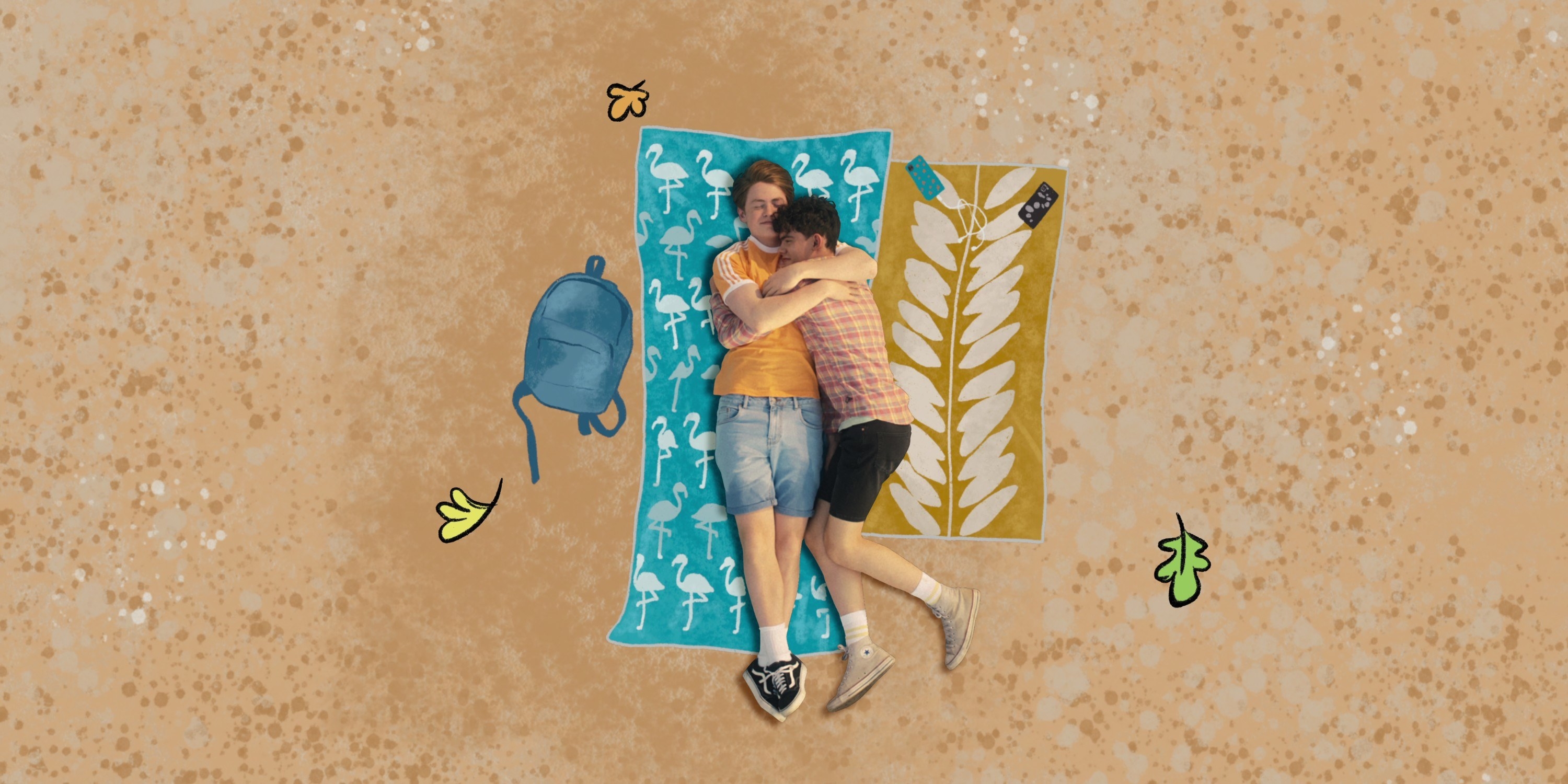 Two people lying together and hugging on a beach blanket