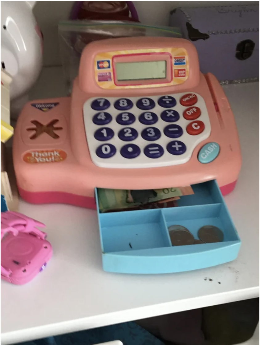 Money in a toy cash register