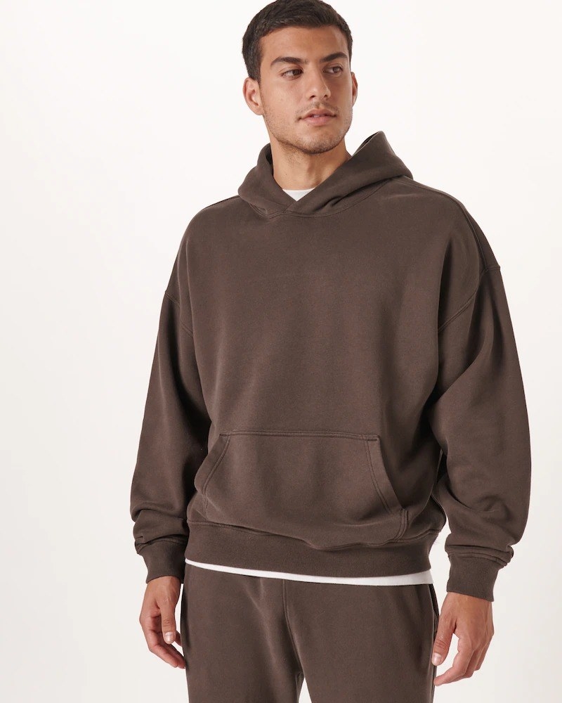 model wearing the hoodie in a brown color with matching sweatpants