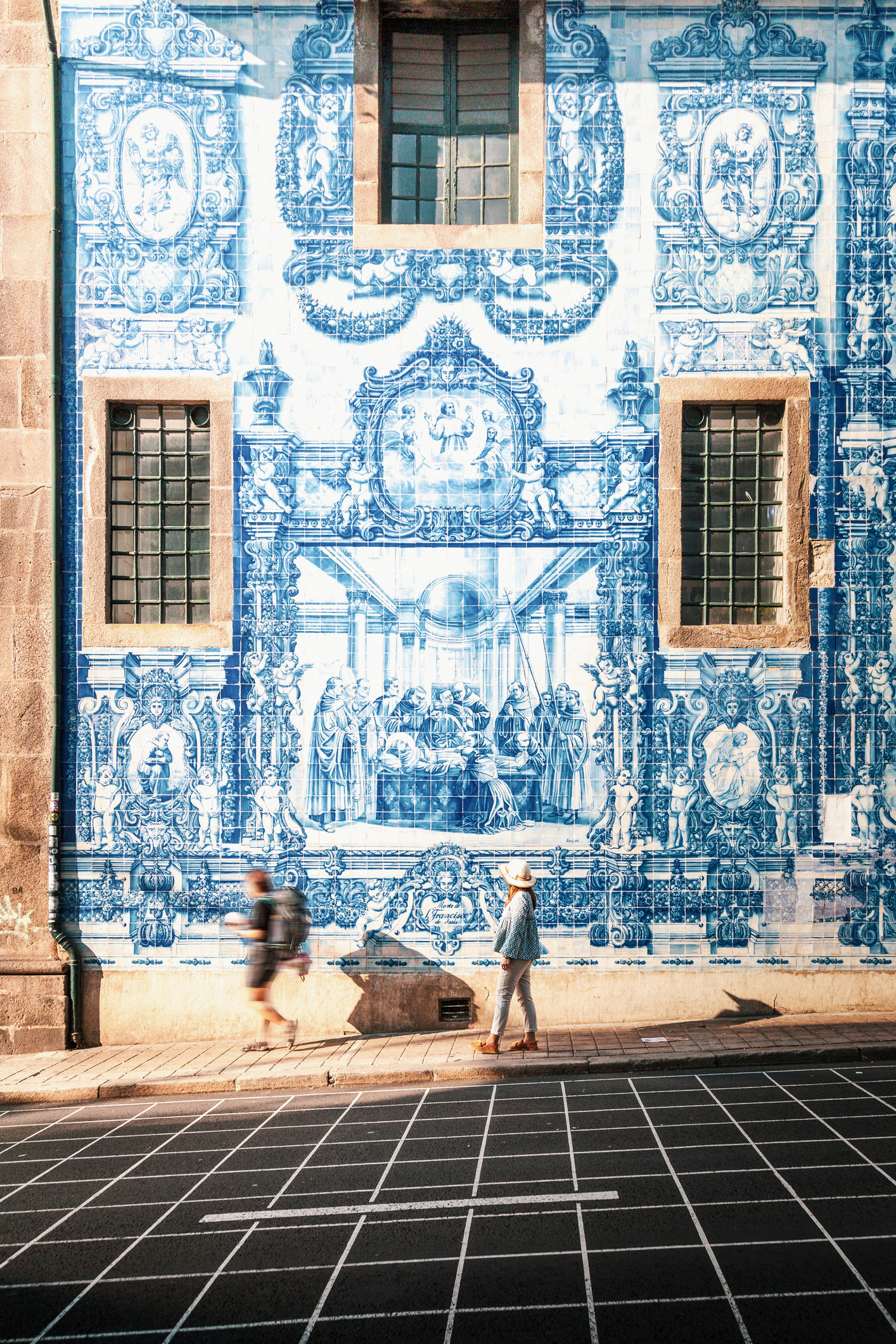 A blue and white tile wall in Porto.