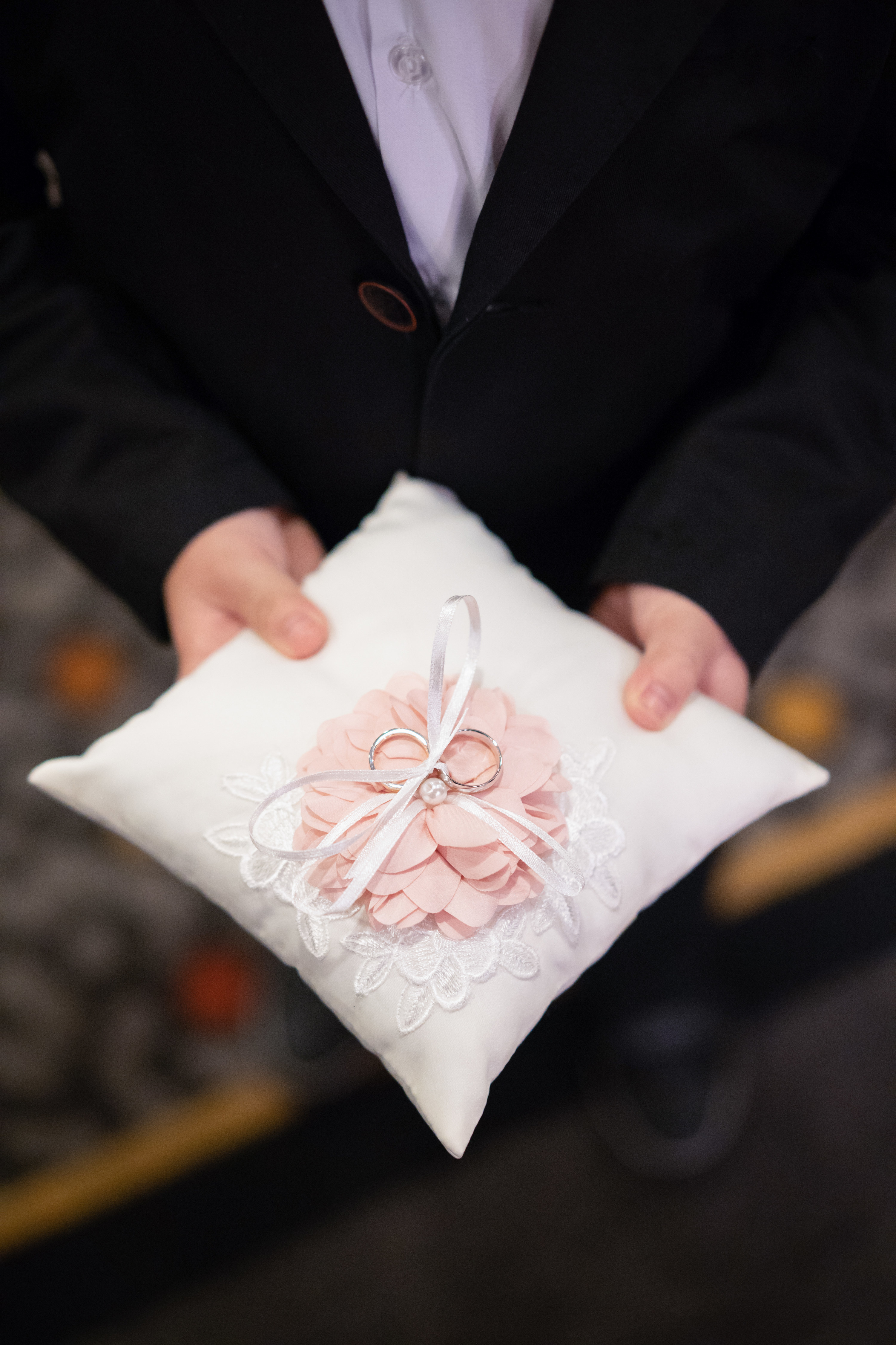 ring bearer holding pillow with rings