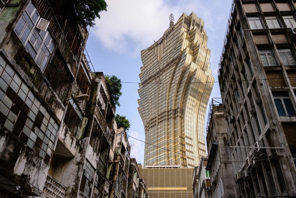The ornate Grand Lisboa stands over run-down buildings in Macao
