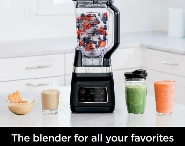 The blender blending a smoothie in a kitchen