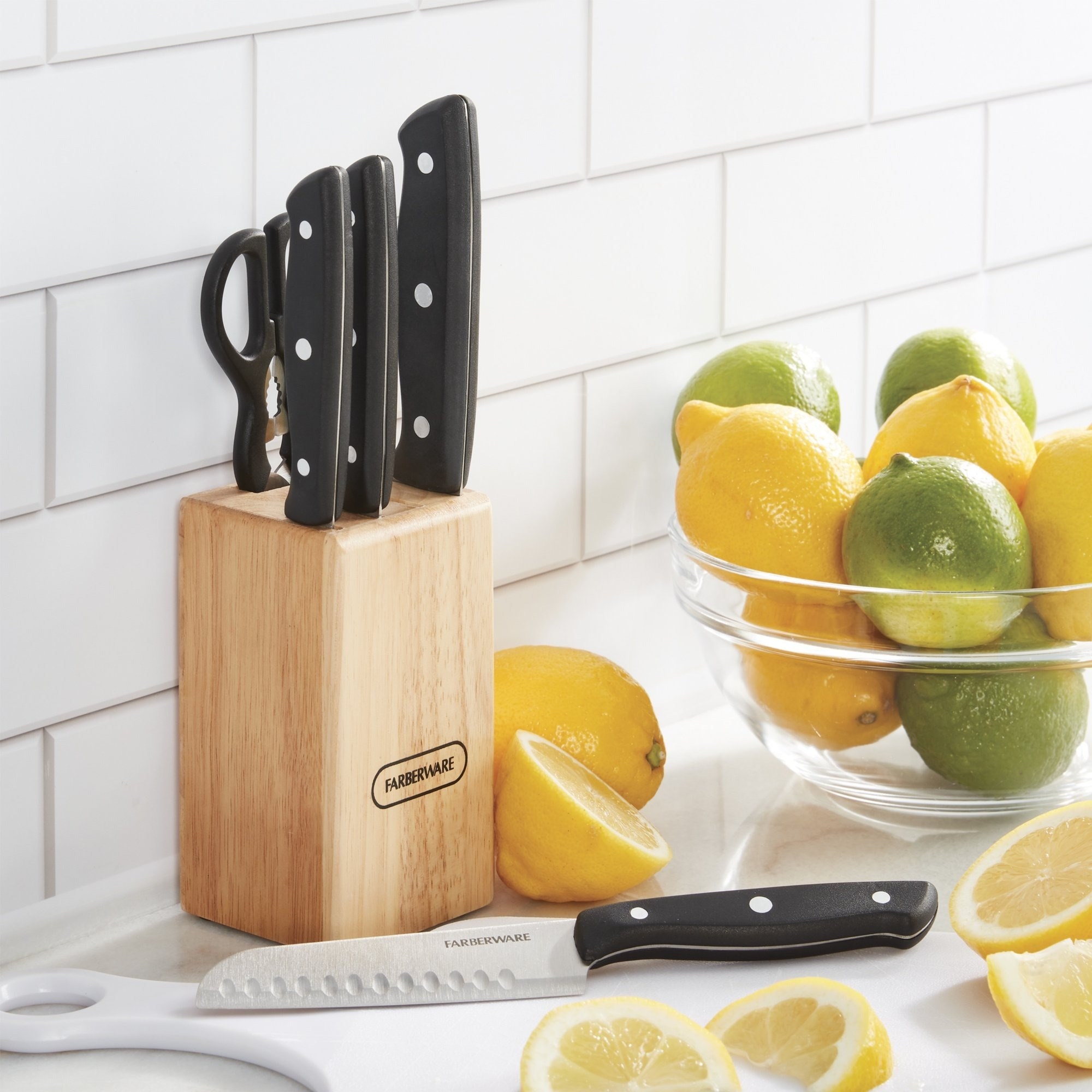 The knife set with a wooden block on a kitchen counter