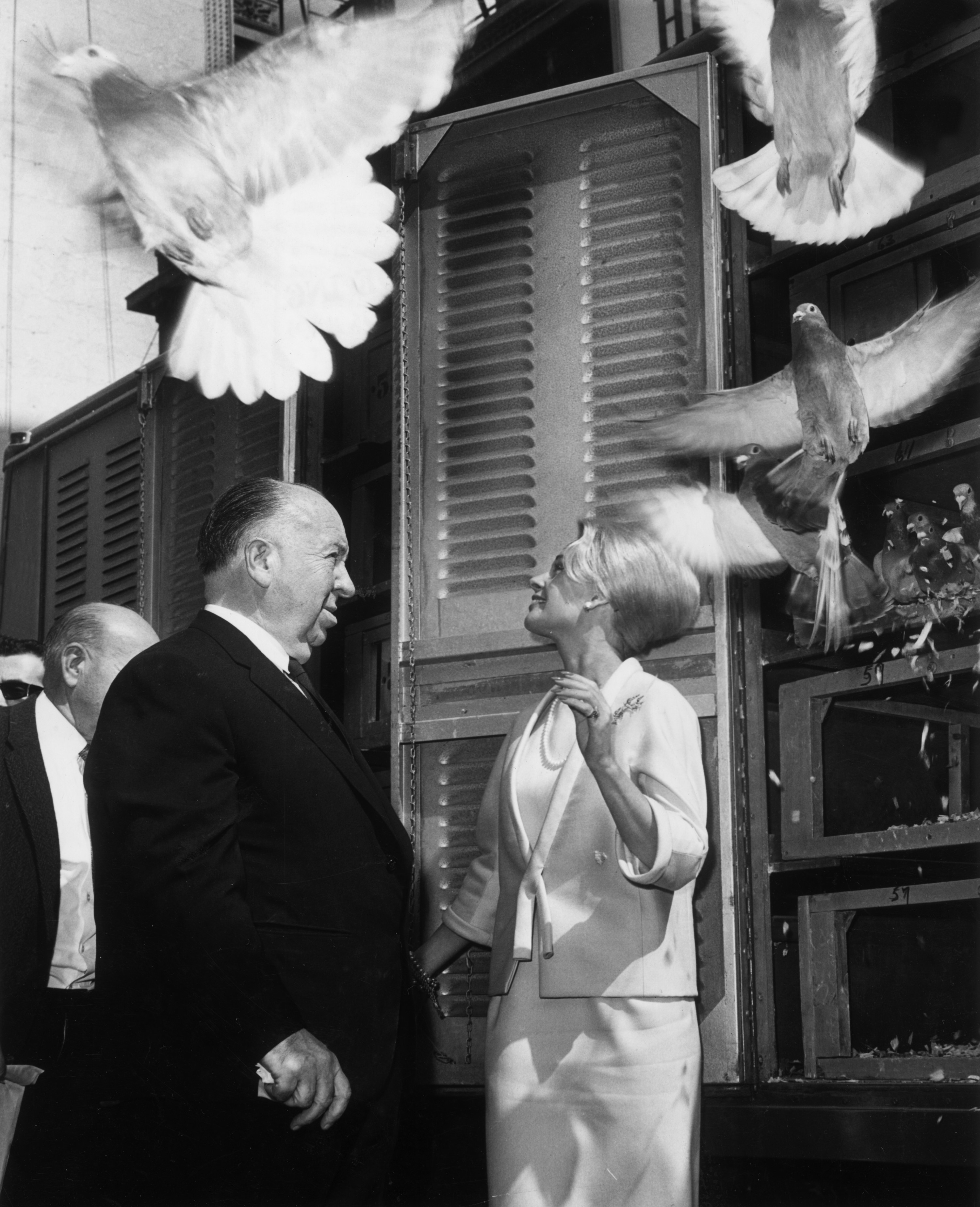 American actress Tippi Hedren and English-born film director Alfred Hitchcock (1899-1980) release 1,000 pigeons at the RKO Palace Theater in New York City