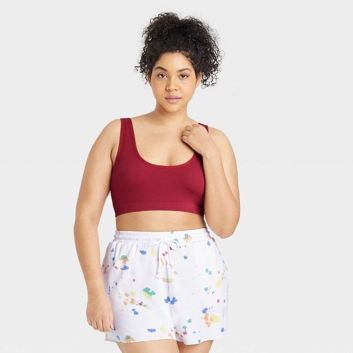 Model wearing the red bralette