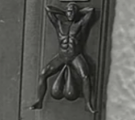 A door knocker with large testicles