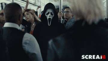 gif of Ghostface standing on a subway car