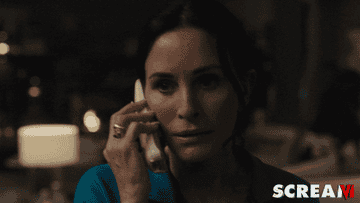 gif of Gayle picking up the phone as Ghostface is running around behind her