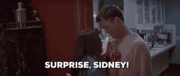 gif of Stu looking down at Sidney, saying, &quot;surprise, sidney&quot;