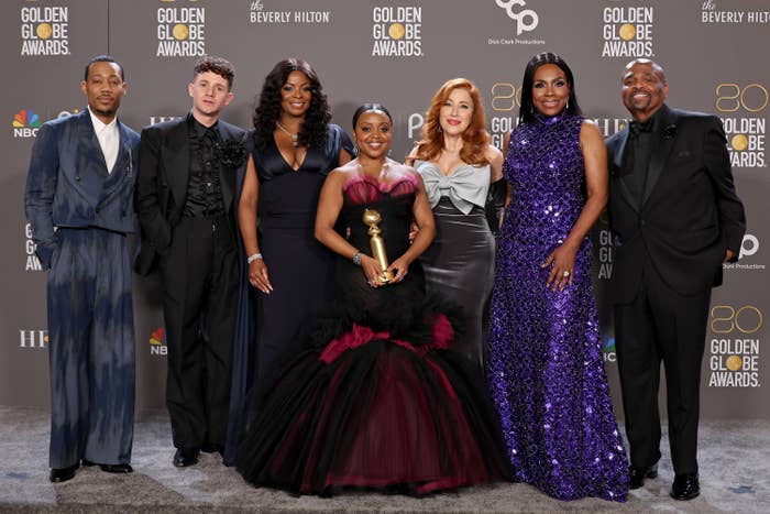 The cast of Abbott Elementary, with Quinta Brunson holding an award
