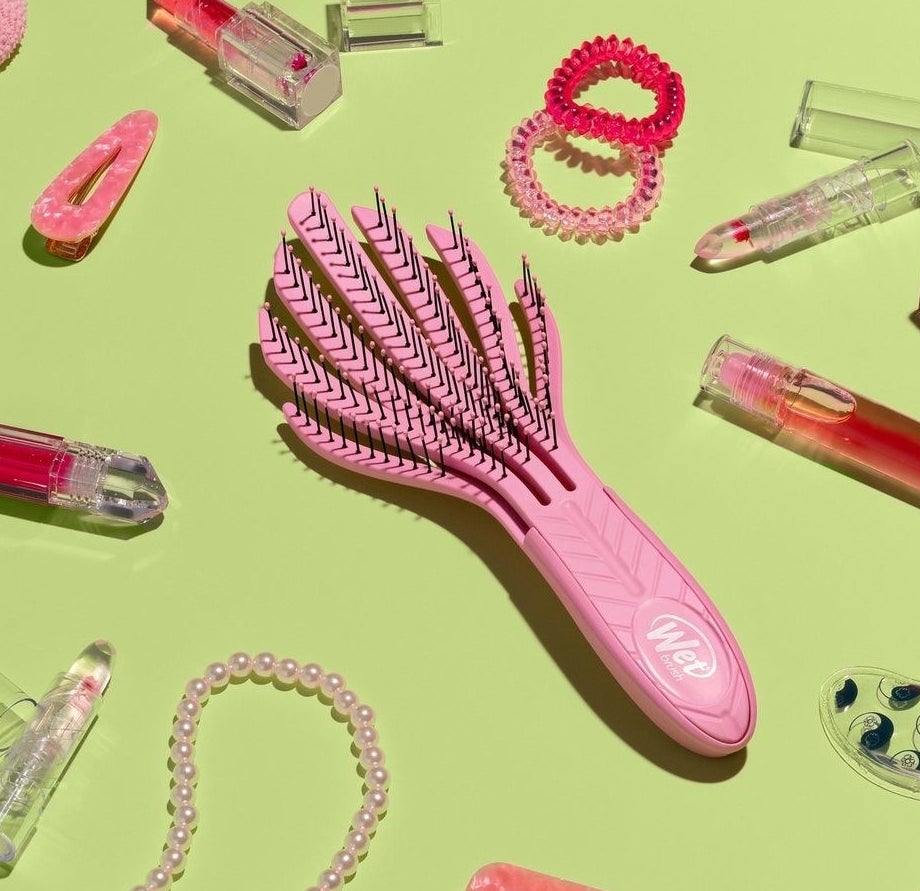 The brush on a table with accessories and beauty products