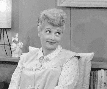 a gif of Lucille Ball batting her eyelashes