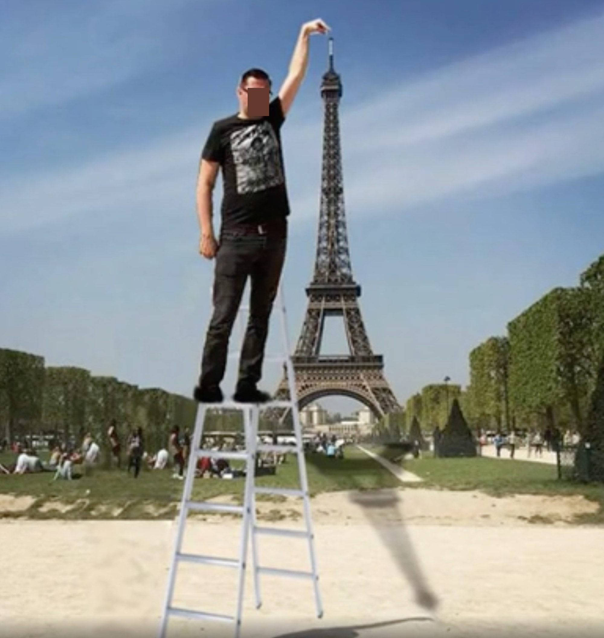 A photoshopped image of a man in front of the Eiffel Tower