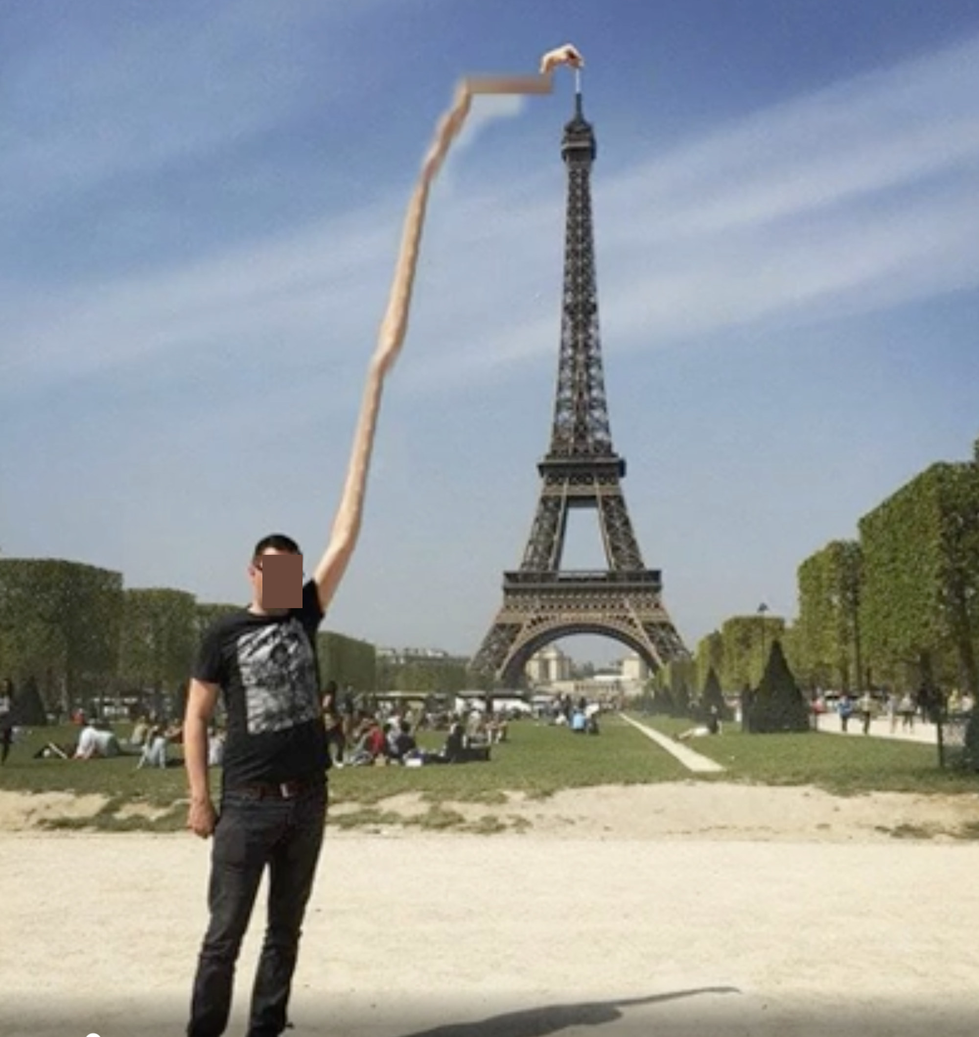 A Photoshopped image of a man in front of the Eiffel Tower