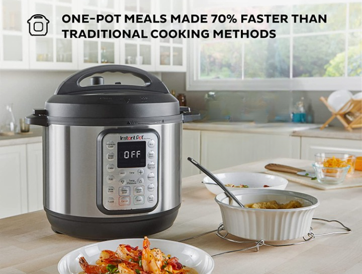 the instant pot on a counter next to dishes of food