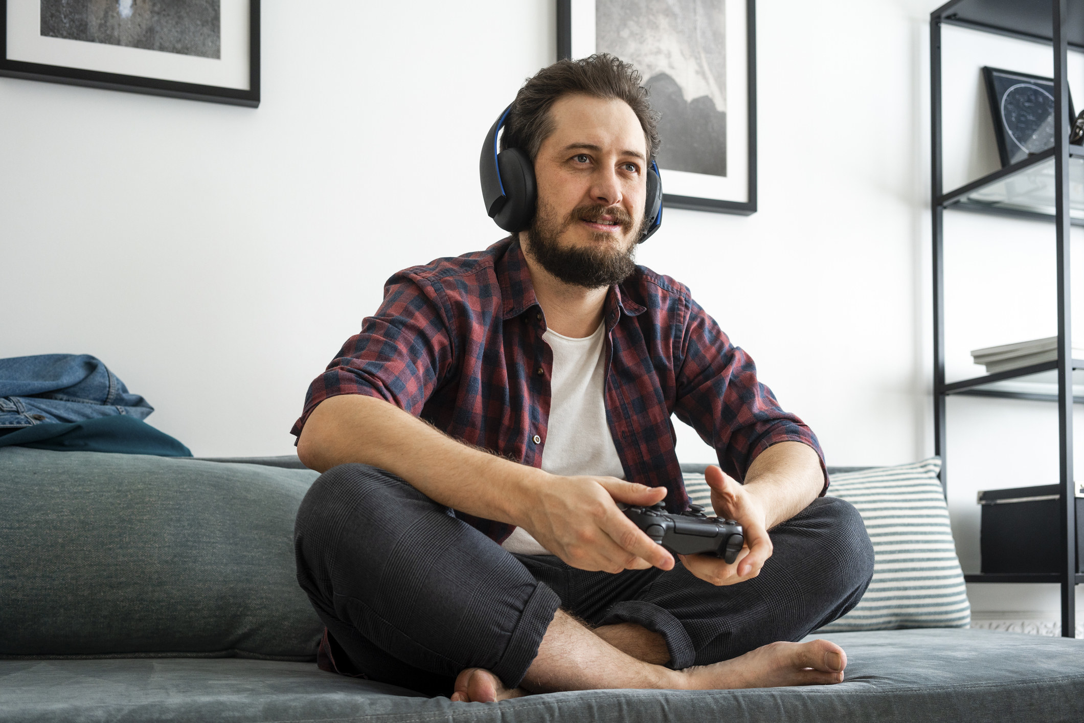 Man playing video games on couch