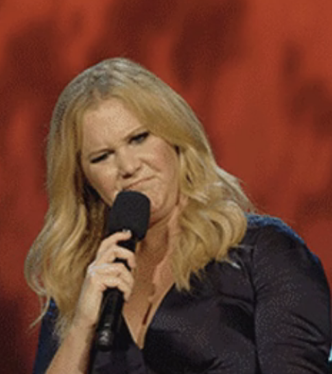 closeup of a woman holding a mic