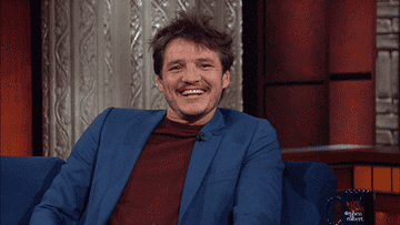 Pedro smiling on a talk show