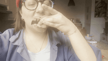 author eating one of the cookie bars