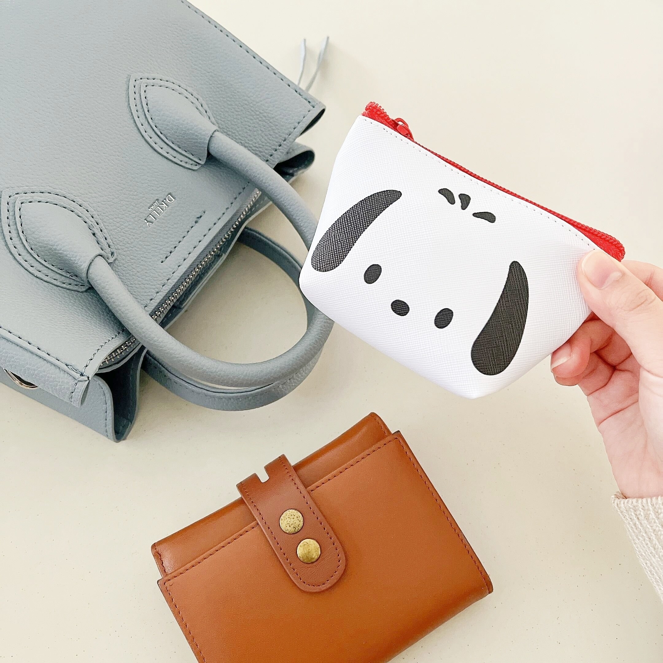 DAISO(ダイソー)のおすすめのアイテム「ミニポーチ(舟形)ポチャッコ フェイス」