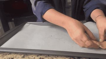 author lining sheet pan with cookie dough