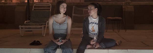 Mariana and Callie sitting by the pool