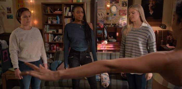 screencap of the girls staring at Bella, who is appeared to be possibly naked and out of frame